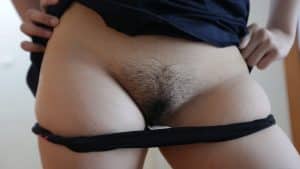 Schoolgirl Uniform Fuck with skirt lifted and panties down to reveal hairy pussy mound