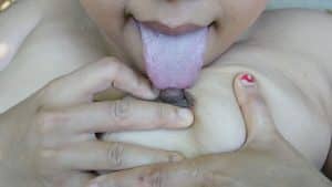 Chubby Malay MILF licking her own nipple