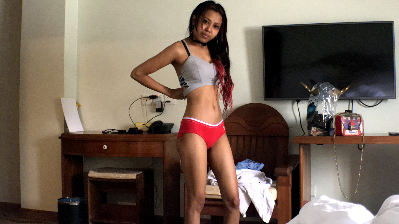 Asian Getting Dressed in Morning