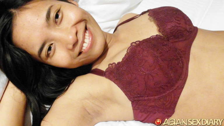 Asian smiles with nice tits in sexy red bra