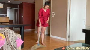 Cute girl cleaning my apartment with broom