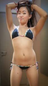Asian Sex Diary Anza puts arms up and shows tiny bra and panties