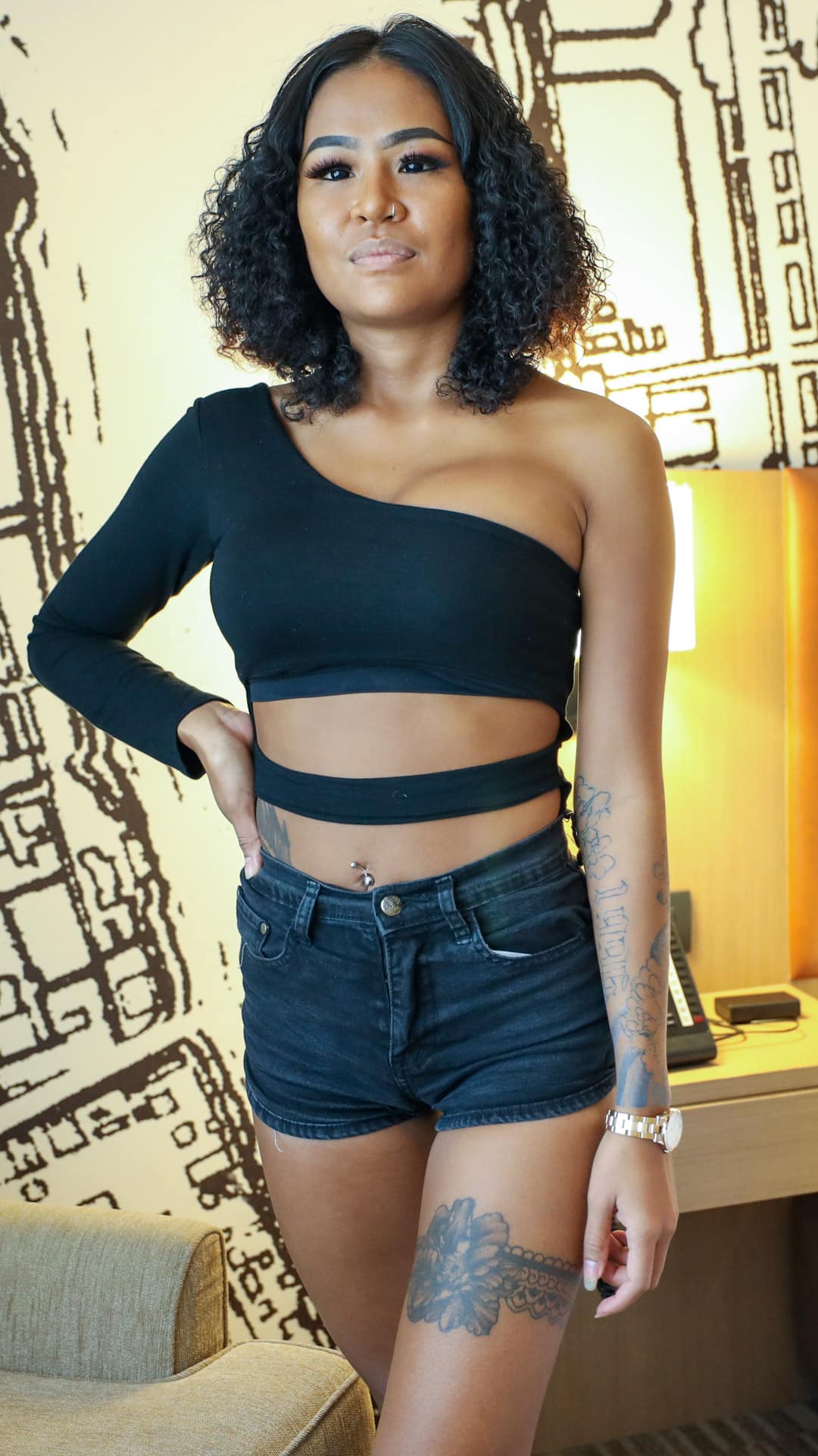 Brown skin beauty Asian Sex Diary Wan E models her leg tattoo