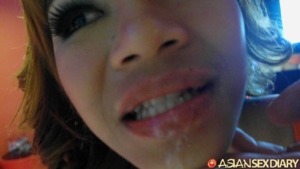 Close view of cum on her mouth and chin