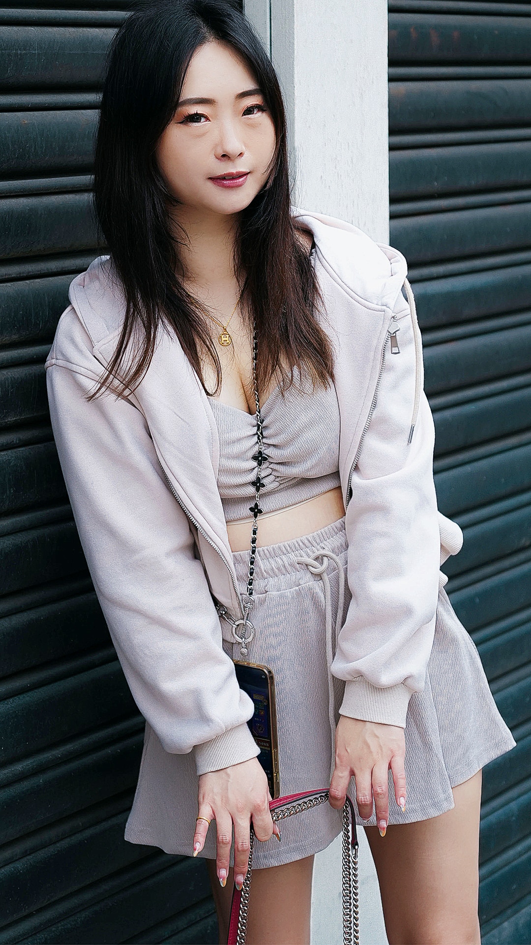 Asian Sex Diary Ying Ying poses in skirt with purse