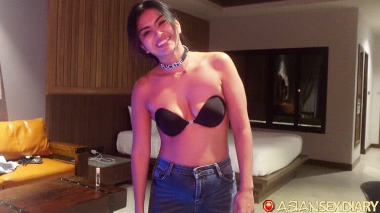 Topless in bra with big smile