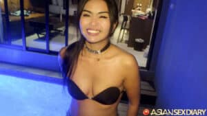Posing and smiling near jet tub