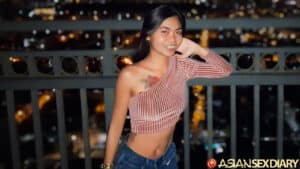 Leaning against balcony on high rise