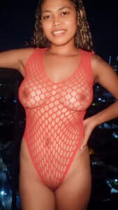 Big tits Kalani models in fishnet body suit on balcony