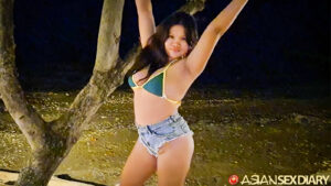 Chubby Pinay teen with arms up in short shorts