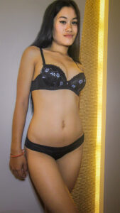 Chinese girl Shi stands pretty in black bra and panties