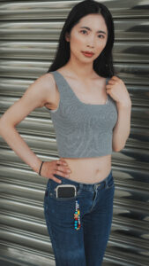 Xiaomei poses outdoors in low rise jeans