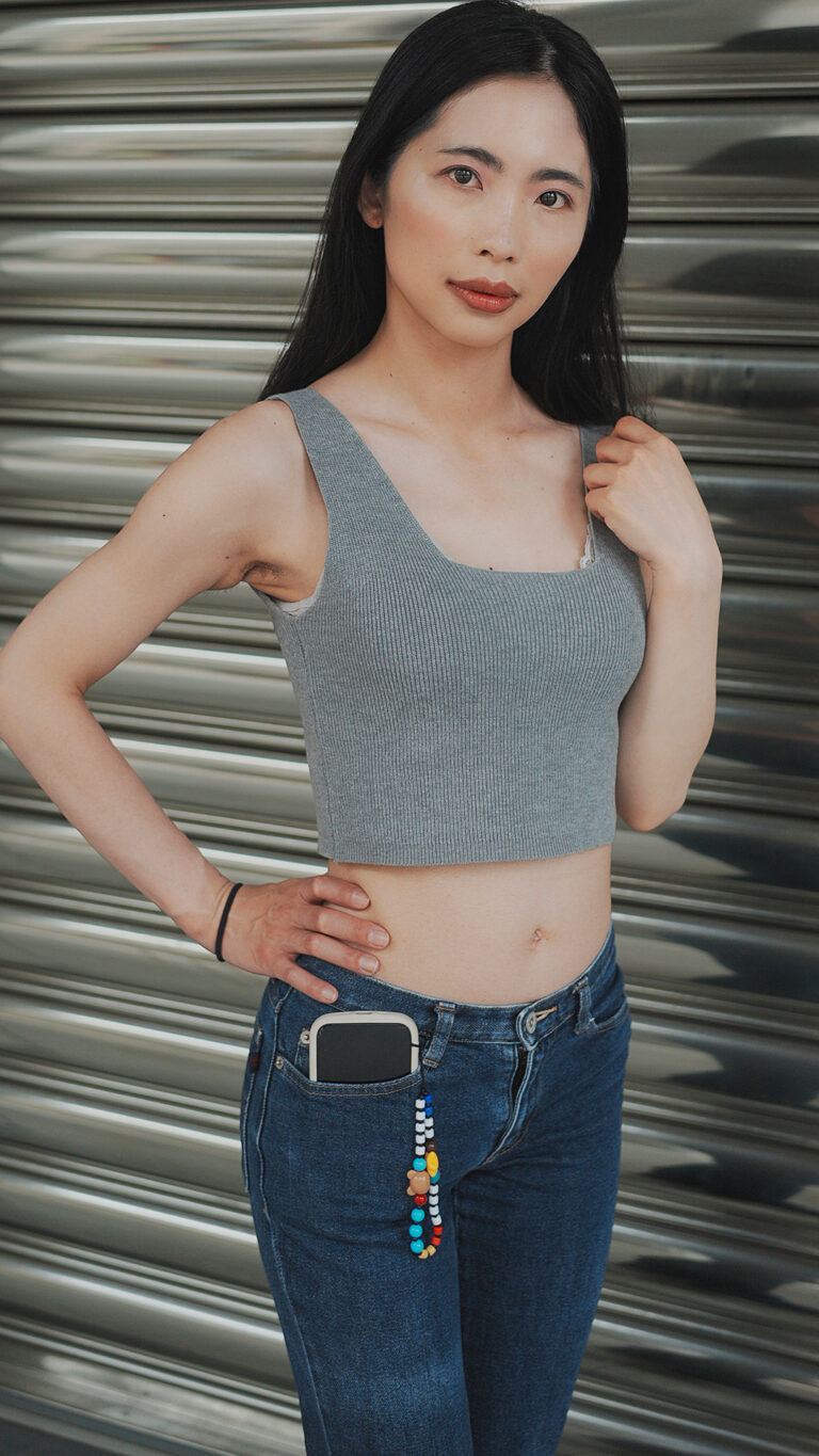 Xiaomei poses outdoors in low rise jeans